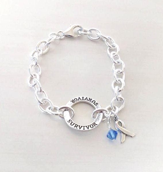 Survivor Blue Charm Bracelet Crystal Charm and Silver Awareness Ribbon Colon Cancer Arthritis Child Abuse Dystonia Reyes Syndrome
