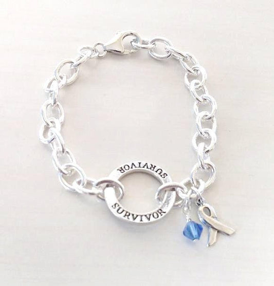 Survivor Blue Charm Bracelet Crystal Charm and Silver Awareness Ribbon Colon Cancer Arthritis Child Abuse Dystonia Reyes Syndrome